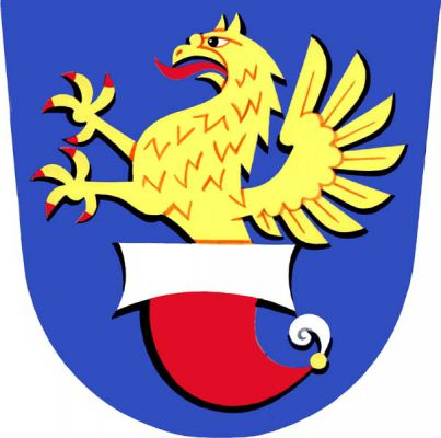 V modrém štítě zlatý gryf s červenou zbrojí vyrůstající z obrácené červené tatarské čepice se stříbrným lemem a pštrosím perem na vrcholu. Znak Všechovice