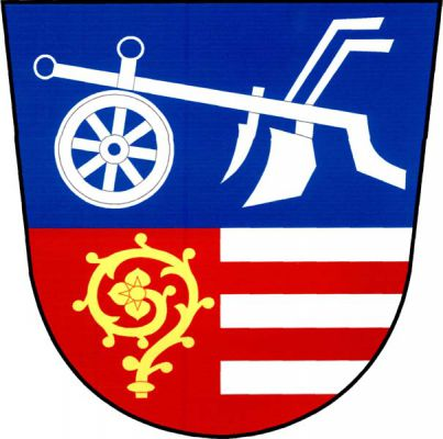 Dělený štít, nahoře v modrém poli stříbrný pluh s kolem, dole polcený, v pravém červeném poli zlatá hlavice berly, levé pole pětkrát stříbrno-červeně dělené. Znak Vstiš