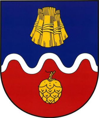 Modro-červeně stříbrným zúženým vlnitým břevnem dělený štít. Nahoře pět o sebe opřených obilných snopů, dole svěšená chmelová šiška, vše zlaté. Znak Žiželice